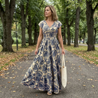 👗 50% RABATT NU! 🌸 Kvinnors V-ringad Blommönstrad Smockad Maxiklänning – Smockad Midja, Andningsbar & Mångsidig Längd ✨