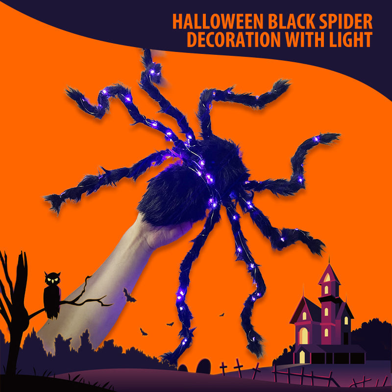 Halloween-dekoration med svart spindel och ljus