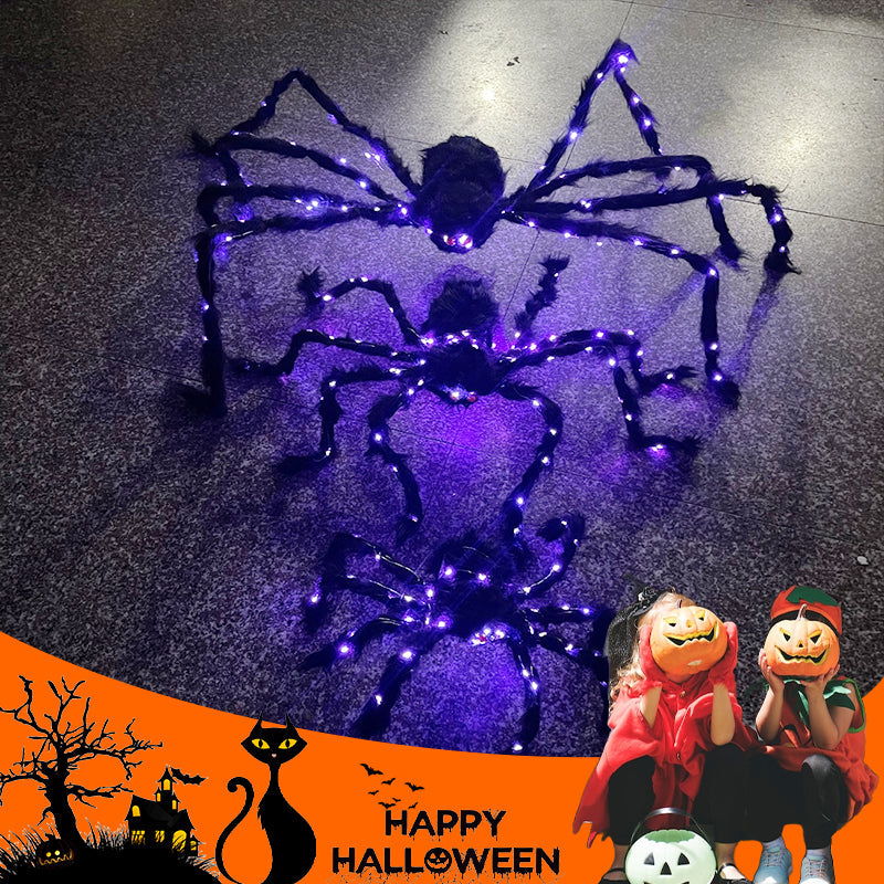Halloween-dekoration med svart spindel och ljus