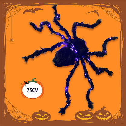Halloween-dekoration med svart spindel och ljus