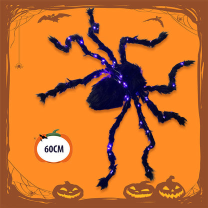 Halloween-dekoration med svart spindel och ljus