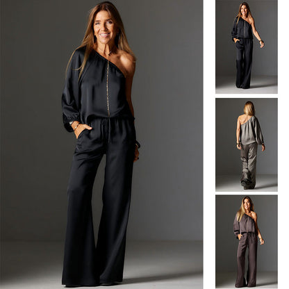 Elegant satin-top med en axel och vida byxor