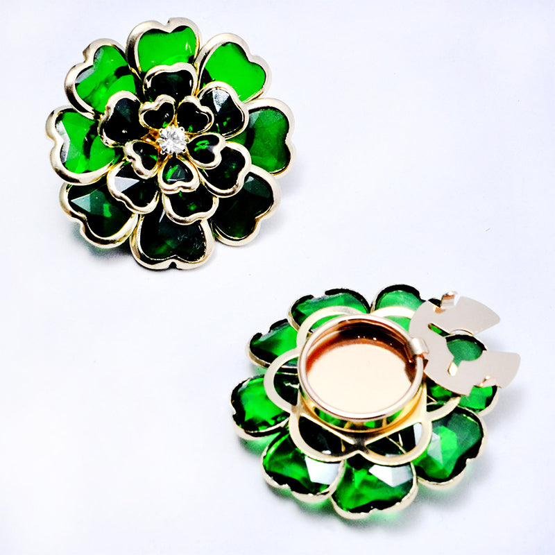 Elegant manschettknapp och brosch med strass och blommönster