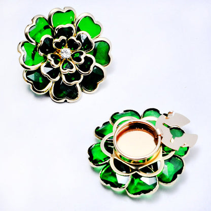 Elegant manschettknapp och brosch med strass och blommönster