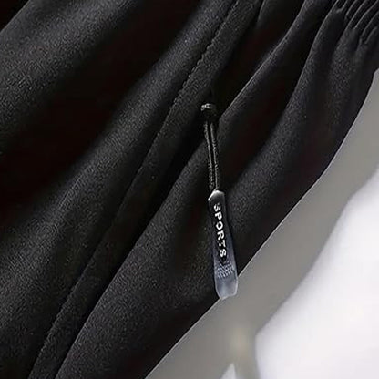 Snabborkande sportshorts för herr med fickor med dragkedja