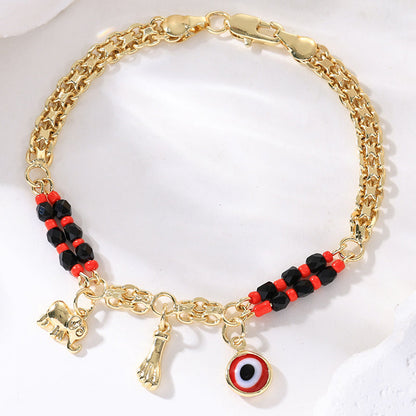 Bohemiskt Onda Ögat Armband – Elefant & Hamsa-berlockare, Guldfärgat, Justerbart ✨