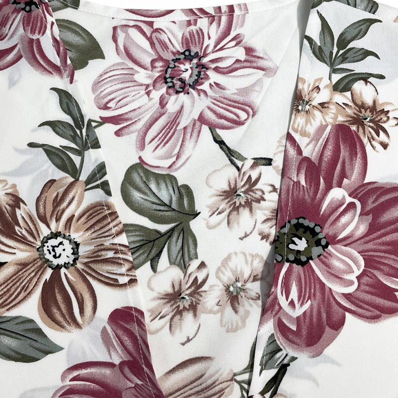 Damtopp med blommigt tryck och lös passform
