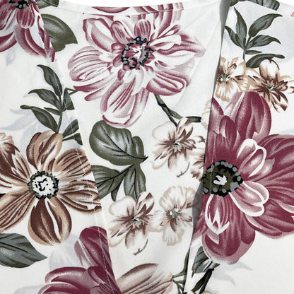 Damtopp med blommigt tryck och lös passform